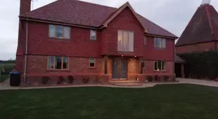 Detached large modern house surrounded by Fields