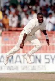 Winston Benjamin bowling for the West Indies during the Champ- Cricket Photo 1