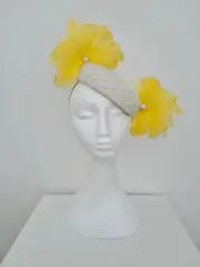 Miss Flo. Womens white leather slanted pillbox with yellow flowers
