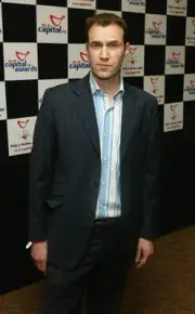Johnny Vaughan poses in the awards room at the Capital FM Awards - 2004 Photo