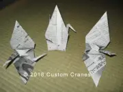 3 paper cranes. 2 cranes showing stock report? Japanese newspaper 11-10-2016