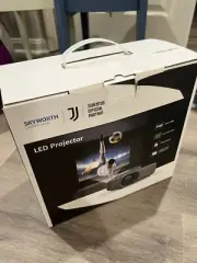 New In Box SKYWORTH LED Projector 1080P WIFI 120” Image IOS Android