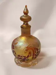 Gold Luster Perfume Bottle With Wave Design.