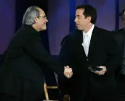 Comedian Robert Klein congratulates comedian Jerry Seinfeld after - Old Photo