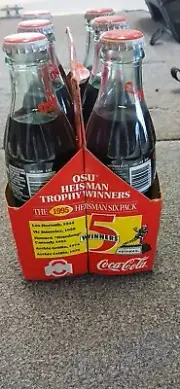 Unopened 1995 OSU Heisman Trophy Collectable Coke Bottles.