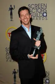 Actor Sean Hayes poses backstage with his Outstanding Performance - Old Photo