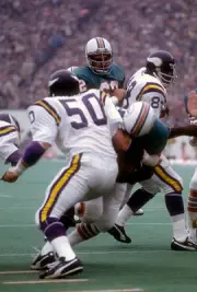 Running back Larry Csonka Miami Dolphins is tackled by Jeff Siemo- 1974 Photo 1