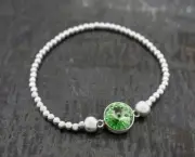 BEADED STRETCH BRACELET W/CENTER CRYSTAL, PERIDOT