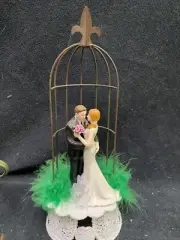Sexy Groom pinches Bride cute butt, Backside behind Wedding Cake Topper top FUN