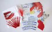 10 PLACEMATS, BIBS, PICKS, CUPS, PLACE CARDS, 20 MOIST TOWELETTES, AND 1 CUTTER