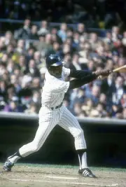 Paul Blair New York Yankees swings and watches the flight of his b- Old Photo