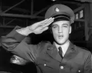 8x10 B&W Photo of Rock Legend Elvis Presley saluting after enlisting in US Army.