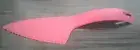 Tupperware bright pink cake cutter/slide