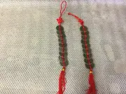 2 x 9 chinese coins x 25mm dia on red string with red knot. Feng shui