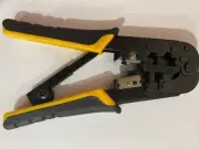 Yellow network cable crimper and wire stripper heavy duty tool