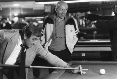 Lino Ventura plays pool under the eye of director Jose Giovanni du- Old Photo