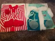 2 Teddy Ruxpin outfits. Out of package but still attached to cardboard