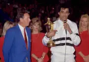 Yannick Noah of France speaks to the crowd whilst holding the tro - Old Photo