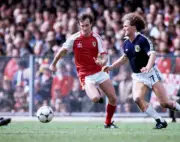 Leighton Phillips of Wales and Davie Provan of Scotland in action - Old Photo