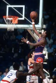 Charlie Scott Phoenix Suns lays the ball up over Nick Weatherspoo- 1974 Photo