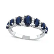Oval Blue Sapphire and 0.17 CT. T.W. Natural Diamond Graduated Seven Stone Alternating Trios Ring in Solid 10K White Gold