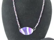 Lace Agate gem stone Pendant on a necklace of Amethyst beads, matching earrings.