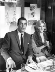 Daniela Bianchi Sean Connery sitting at a dining table together in- Old Photo