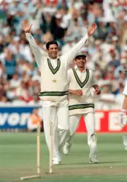 Wasim Akram in action for Pakistan circa 1996 Old Cricket Photo 2