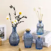 Blue Glass Reed Diffuser Bottles, Embossed Flower Vases with Cork Lids, Set of 4