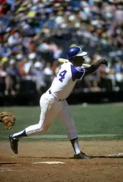 Outfielder Hank Aaron Atlanta Braves swings and misses the pitch - 1974 Photo