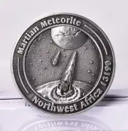 MARTIAN METEORITE INSIDE COLLECTORS COIN 0151, NORTH WEST AFRICA 13190 MT141