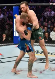 Conor McGregor strikes Donald Cerrone at UFC 246, 2020 Las Vegas 7x5 Photo
