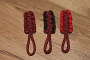 paracord zipper pull - red diamonds on black with black and red