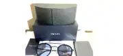 Prada unisex sunglasses spr 56x round lenses black frame made in Italy