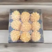 INTERIORS}SET OF 9 PINECONE TEA LIGHT CANDLES-NEW IN BOX