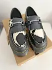 Dr. Martens Adrian Snaffle Quad Platform Loafer Black/Cow Print Women’s 7 / UK 5