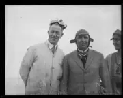 Wizard Smith and Don Harkness at Gerringong Beach wearing motoring- Old Photo