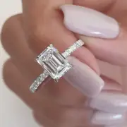 3.01 ct moisaanite emerald with round cut engagement ring