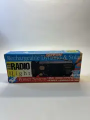 vintage Nippon rechargeable dynamo and solar AM/FM radio with a flashlight