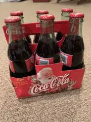 Coca Cola Christmas Collectors Bottles 1999