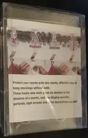 NIB HOBBY LOBBY SET OF 4 METAL HOLIDAY THEMED STOCKING HOLDERS