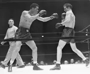 New York Billy Conn keeps a healthy distance from dynamite laden - 1941 Photo