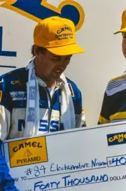 Geoff Brabham celebrates on the podium during the Watkins Glen Pro- Old Photo