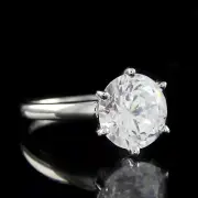 Simple Design Solitaire Style Engagement Ring With White Round Shape Sapphire