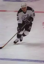 John Cullen Tampa Bay Lightning in action on the ice as he follows- Old Photo 1
