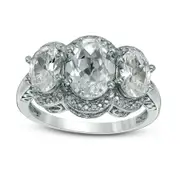 Oval Lab-Created White Sapphire and Diamond Accent Three Stone Frame Ring in Sterling Silver