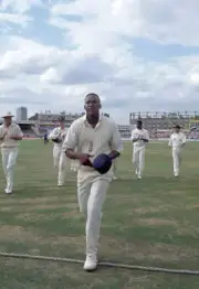 England fast bowler Devon Malcolm leaves the field having tak- Old Cricket Photo