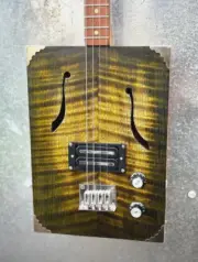 Cigar box guitar - bookmatched fiddleback Vic. mountain Ash by Buzzard Guitars.