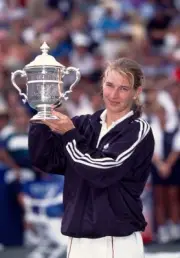 Steffi Graf of Germany poses with the trophy after defeating Monic- Old Photo 1