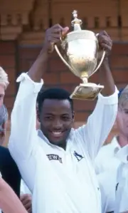 Warwickshire's Brian Lara celebrates with the trophy after Warwick- Old Photo
